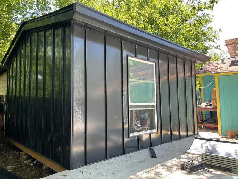 Black standing seam metal wall panels for Roof Inspection in Tucker