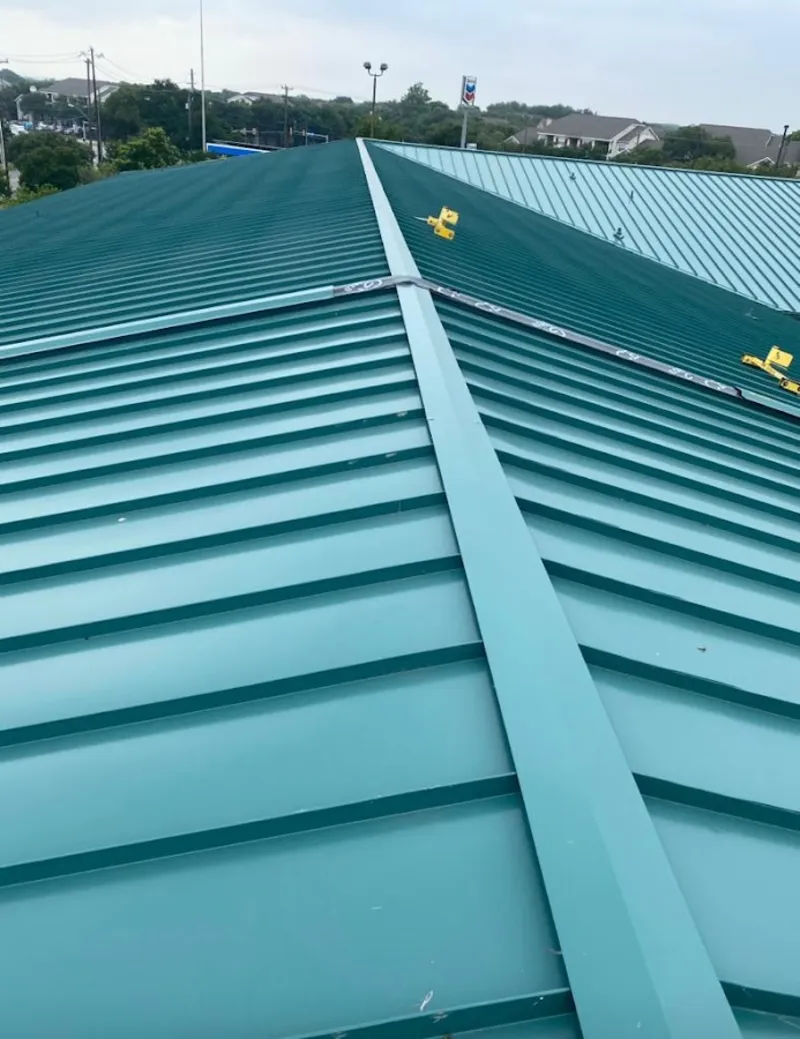 Green commercial metal roof ridge and valley for Metal Roof Repair in Tucker